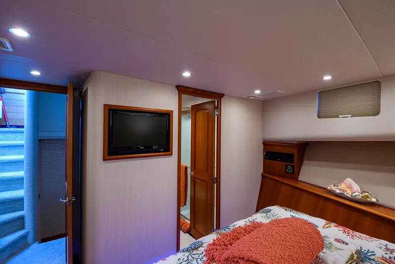 Slide: The Image of Interior of 2009 Pacific Mariner 85 yacht bedroom with TV and cozy decor. - 34