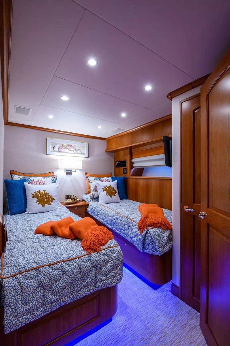 Slide: The Image of Luxurious twin cabin in 2009 Pacific Mariner 85 yacht with elegant bedding and ambient lighting. - 35