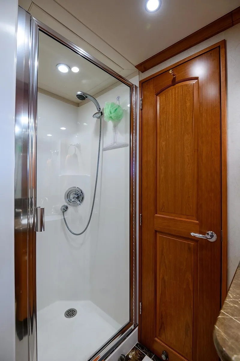 Slide: The Image of Shower area in 2009 Pacific Mariner 85 yacht with wooden door and modern fixtures. - 38
