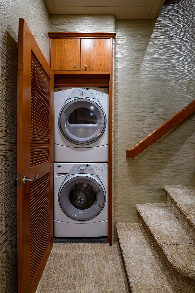 Slide: The Image of Laundry area with stacked washer and dryer in 2009 Pacific Mariner 85 yacht. - 42