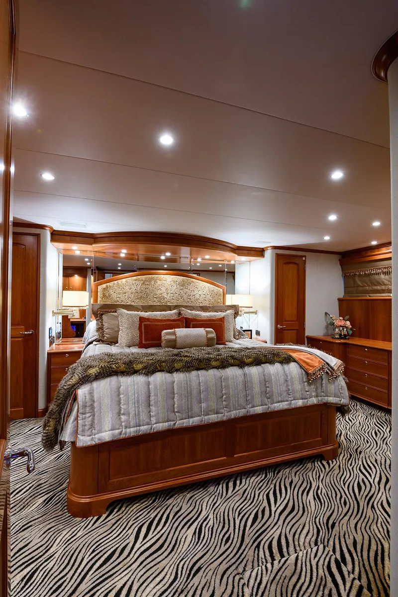 Slide: The Image of Luxurious bedroom interior of 2009 Pacific Mariner 85 yacht with elegant wood finishes. - 43