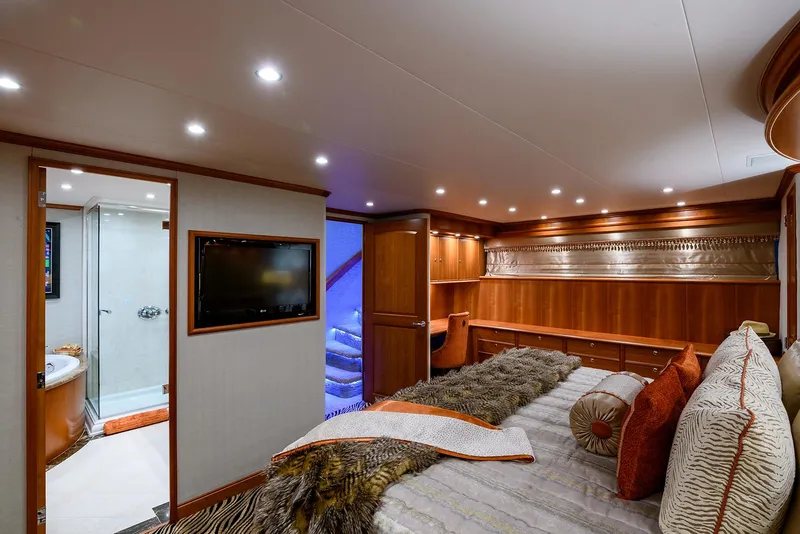 Slide: The Image of Luxurious bedroom interior of 2009 Pacific Mariner 85 yacht with elegant wood finishes. - 45