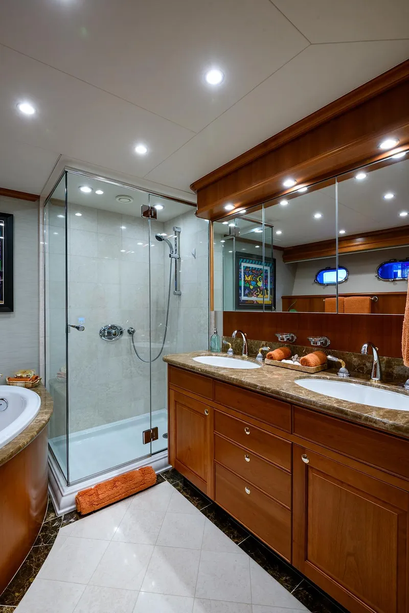 Slide: The Image of Luxurious bathroom in 2009 Pacific Mariner 85 yacht with glass shower and dual sinks. - 47