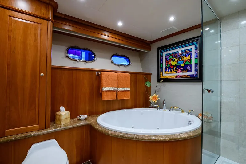 Slide: The Image of Luxurious bathroom in 2009 Pacific Mariner 85 yacht with jacuzzi and elegant wood paneling. - 49