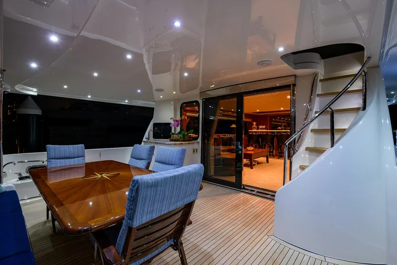 Slide: The Image of Luxurious 2009 Pacific Mariner 85 yacht interior with elegant dining area and spiral staircase. - 6