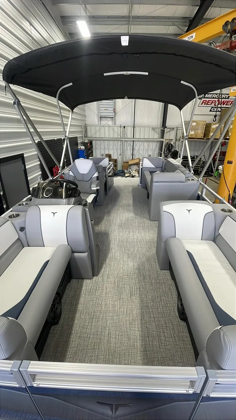 Slide: The Image of 2025 Tahoe Pontoon SP 1980 Quad Lounge with canopy in storage facility. - 12