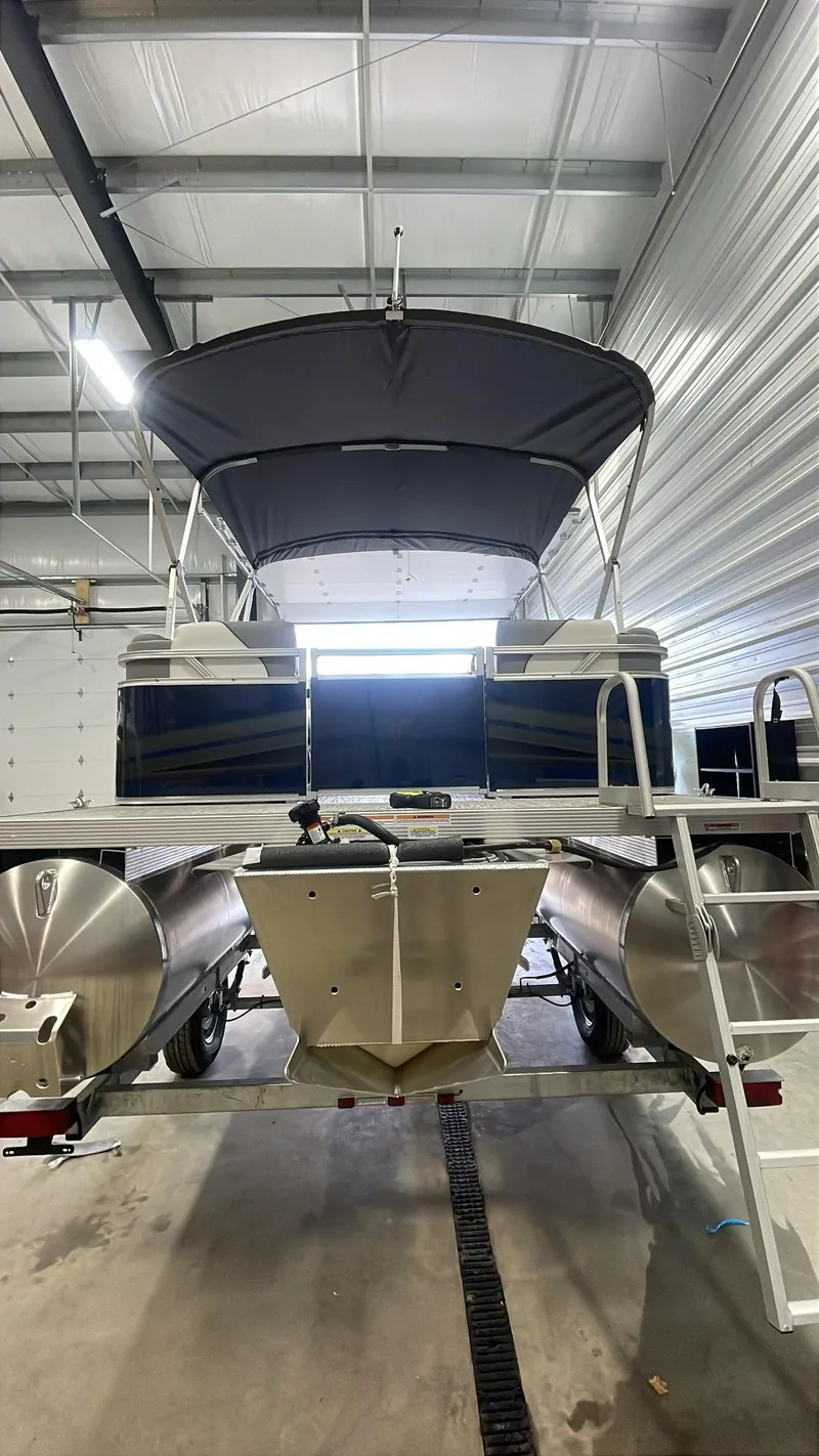 Slide: The Image of 2025 Tahoe Pontoon SP 1980 Quad Lounge Pontoon in a storage facility. - 3