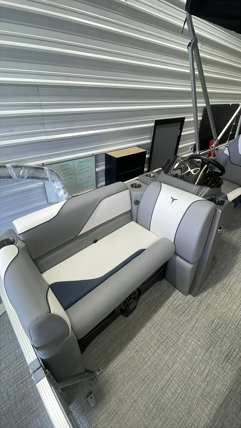 Slide: The Image of 2025 Tahoe Pontoon SP 1980 Quad Lounge interior with modern seating and sleek design. - 9