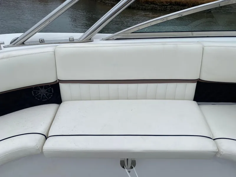 Slide: The Image of White seating on a 2013 Cobalt 302 boat, near water. - 11