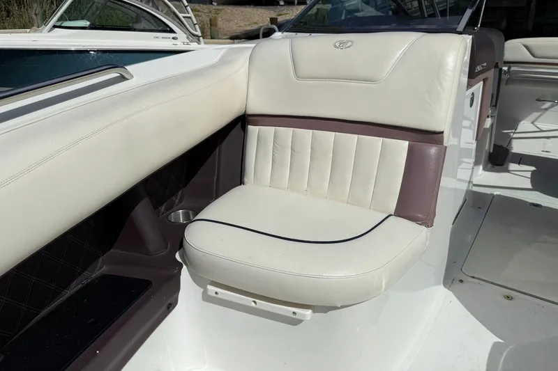 Slide: The Image of 2013 Cobalt 302 boat interior with white and maroon seating. - 22