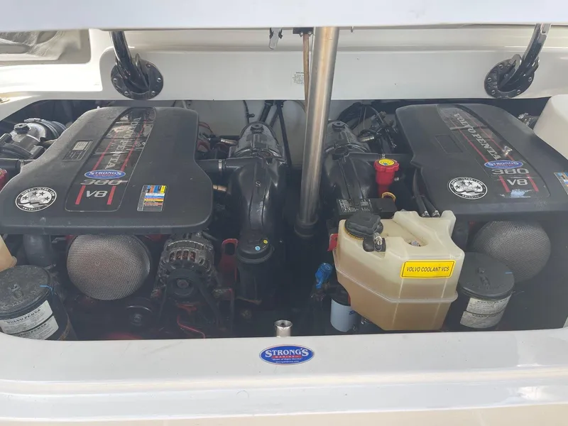 Slide: The Image of Engine compartment of a 2013 Cobalt 302 boat with dual V8 engines. - 27