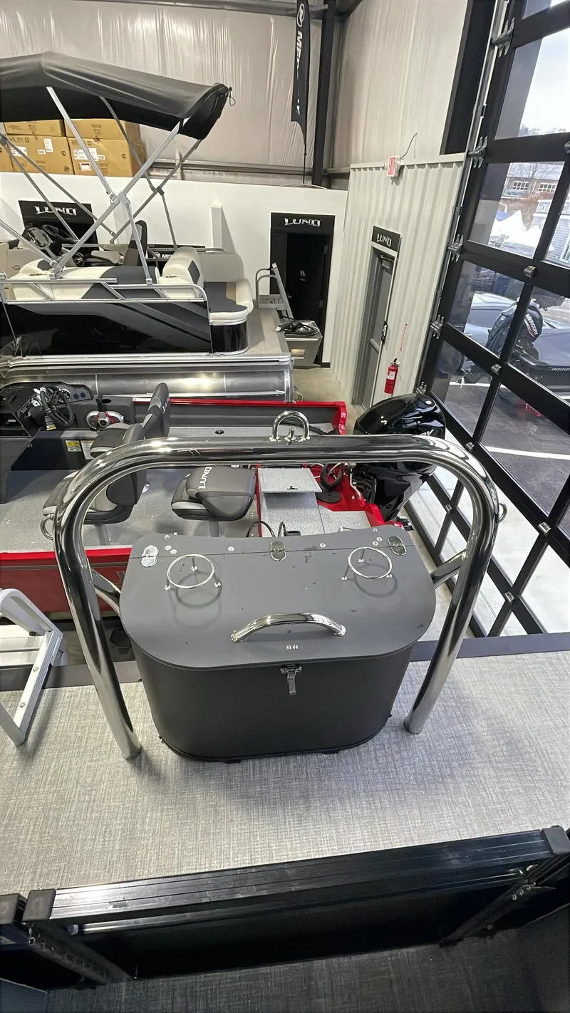 Slide: The Image of 2025 Tahoe Pontoon SP 2385 QL interior with sleek control panel in showroom. - 12