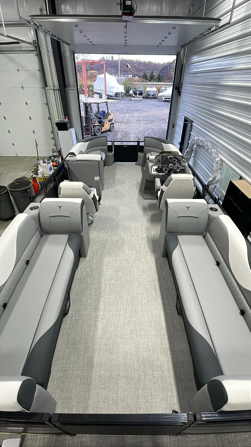 Slide: The Image of 2025 Tahoe Pontoon SP 2385 QL interior with spacious seating and modern design. - 17