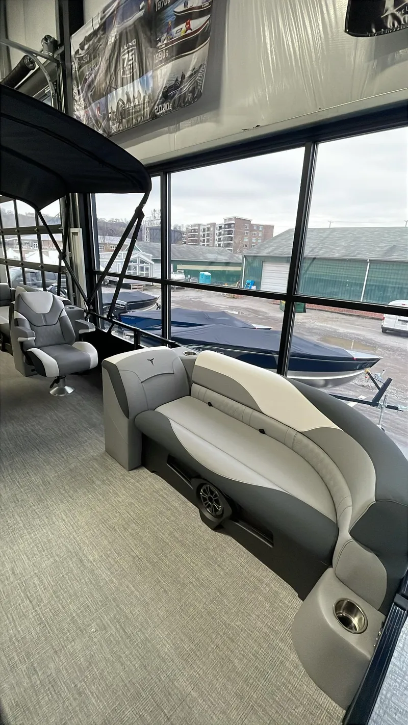 Slide: The Image of 2025 Tahoe Pontoon SP 2385 QL interior with plush seating and modern design. - 5