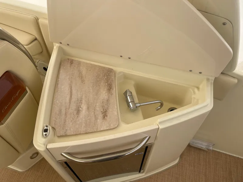 Slide: The Image of 2020 Chris-Craft Launch 28GT boat sink with countertop and storage. - 13