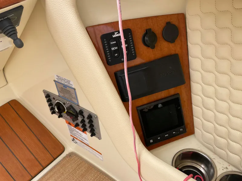 Slide: The Image of 2020 Chris-Craft Launch 28GT dashboard with controls and wood paneling. - 15