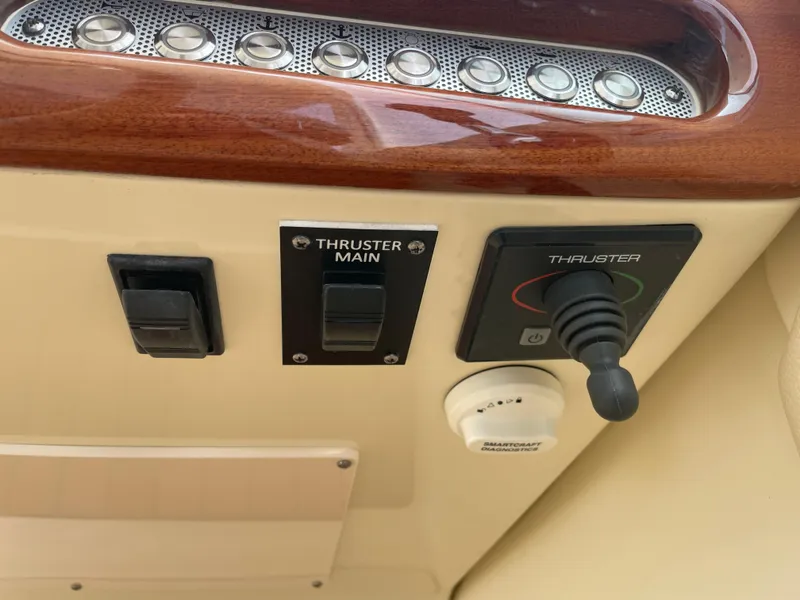 Slide: The Image of Control panel of 2020 Chris-Craft Launch 28GT with thruster controls and switches. - 16