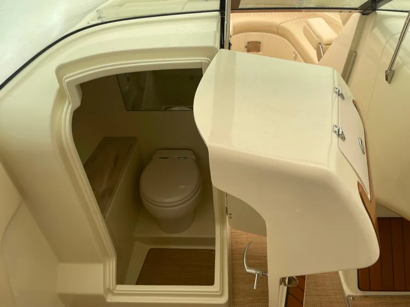 Slide: The Image of 2020 Chris-Craft Launch 28GT boat interior with compact bathroom and toilet. - 23
