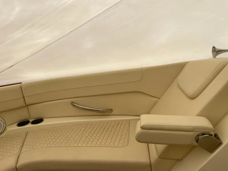 Slide: The Image of 2020 Chris-Craft Launch 28GT interior with beige leather seating and cup holders. - 29