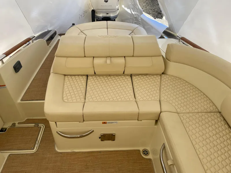 Slide: The Image of 2020 Chris-Craft Launch 28GT boat interior with beige leather seating and elegant design. - 6