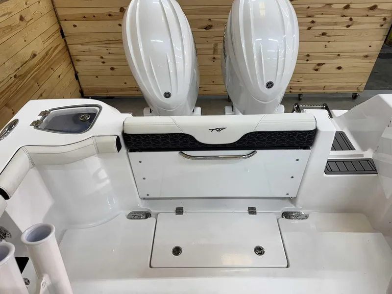 Slide: The Image of 2025 Tidewater 256 CC Adventure boat interior with dual engines and sleek design. - 7