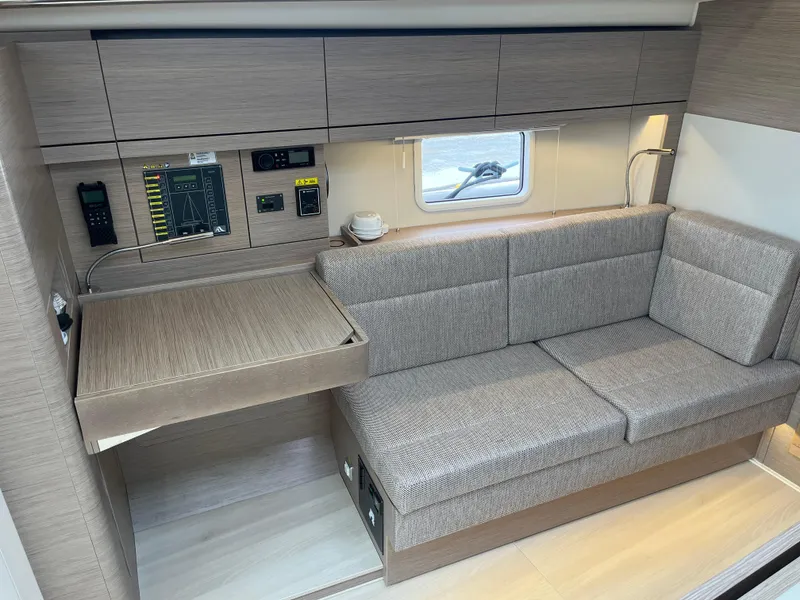 Slide: The Image of Interior of 2021 Hanse 418 yacht with modern seating and control panel. - 37