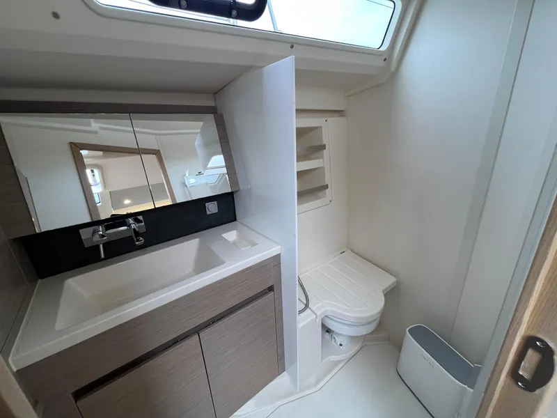 Slide: The Image of Modern bathroom in 2021 Hanse 418 yacht with sink, mirror, and toilet. - 25