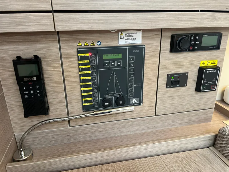 Slide: The Image of Control panel of a 2021 Hanse 418 yacht with navigation and communication systems. - 33