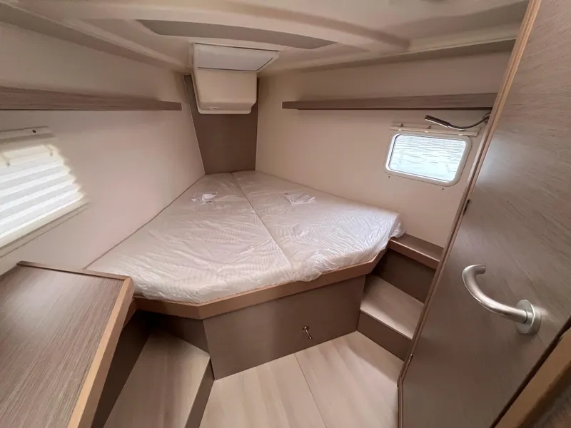 Slide: The Image of Cozy cabin interior of 2021 Hanse 418 yacht with a comfortable bed and wooden furnishings. - 47