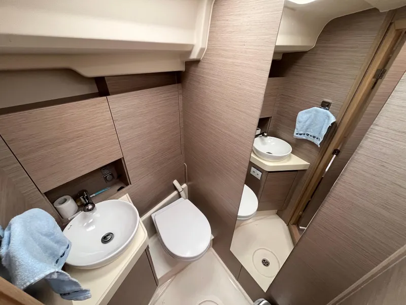 Slide: The Image of Modern bathroom in 2021 Hanse 418 yacht with sink, toilet, and mirror. - 49