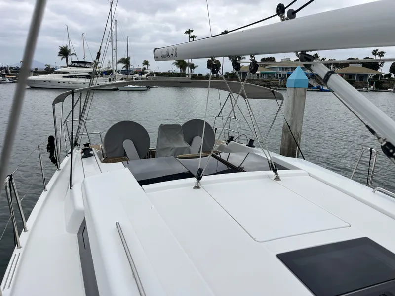 Slide: The Image of 2021 Hanse 418 yacht docked in a marina with overcast skies. - 9