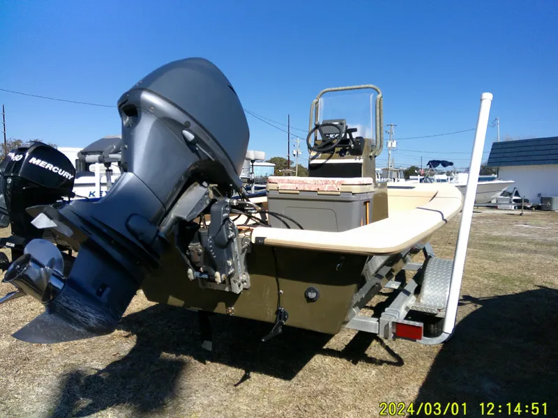 Slide: The Image of 2017 Jones Brothers 17 BATEAU boat with outboard motor on a trailer. - 12