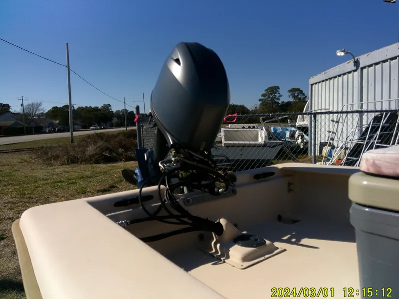 Slide: The Image of 2017 Jones Brothers 17 BATEAU boat with outboard motor in a yard setting. - 15