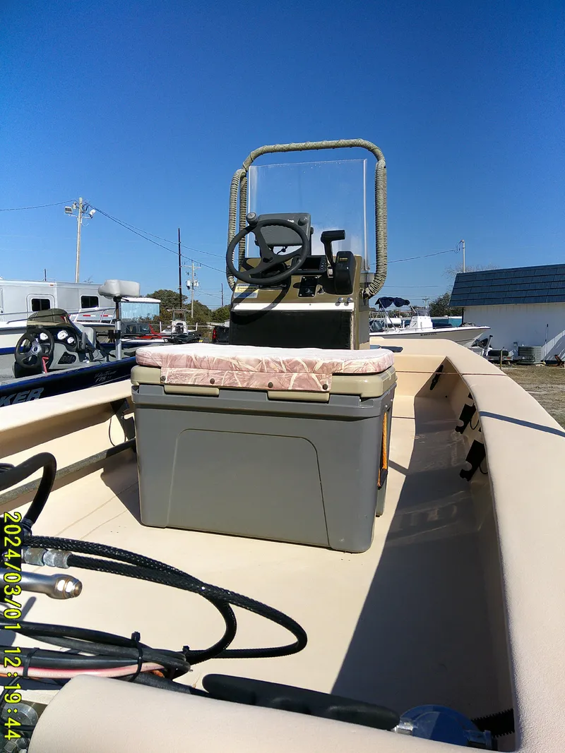 Slide: The Image of 2017 Jones Brothers 17 BATEAU boat with steering console and cooler seat. - 17