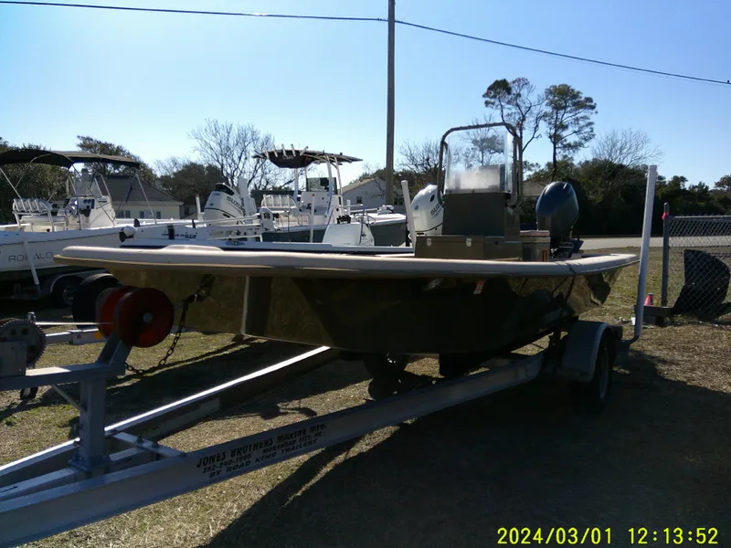 Slide: The Image of 2017 Jones Brothers 17 BATEAU boat on trailer, parked outdoors. - 3