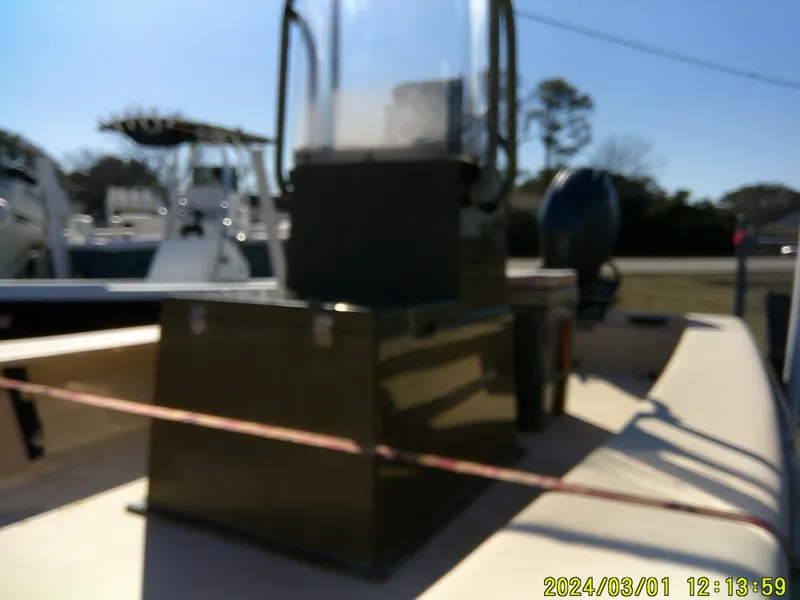 Slide: The Image of Blurry image of a 2017 Jones Brothers 17 BATEAU boat on display outdoors. - 4