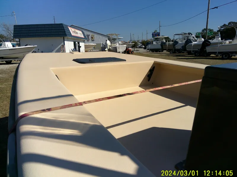 Slide: The Image of 2017 Jones Brothers 17 BATEAU boat on display at a dealership. - 5