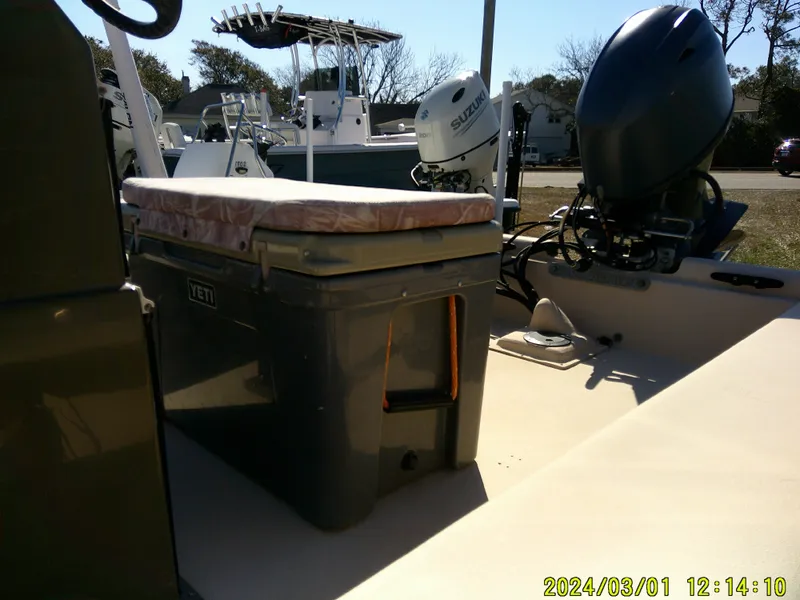 Slide: The Image of 2017 Jones Brothers 17 BATEAU boat with Yeti cooler and Suzuki outboard motor. - 6