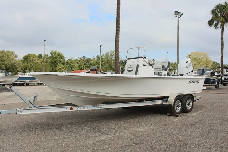 The Image of 2025 Sea Pro 230 Bay boat on trailer in outdoor setting. - 0