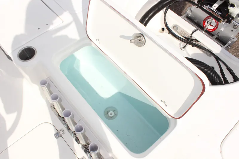 Slide: The Image of 2025 Sea Pro 230 Bay boat livewell and rod holders. - 11