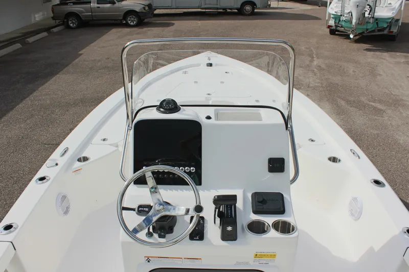 Slide: The Image of 2025 Sea Pro 230 Bay boat console with steering wheel and controls. - 17