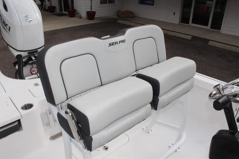Slide: The Image of 2025 Sea Pro 230 Bay boat seating with white and gray upholstery. - 18