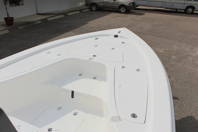 Slide: The Image of 2025 Sea Pro 230 Bay boat bow view, showcasing storage compartments. - 21