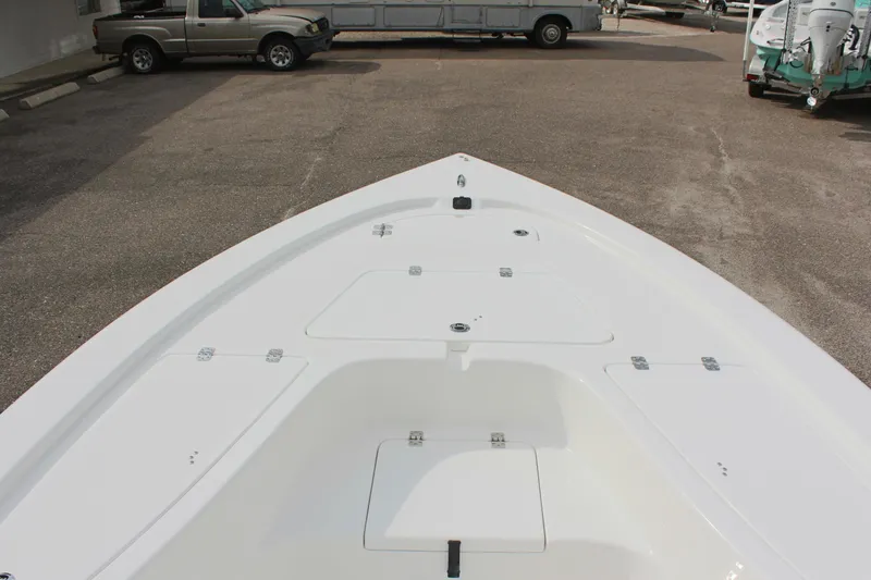 Slide: The Image of 2025 Sea Pro 230 Bay boat deck, white finish, parked in a lot. - 22