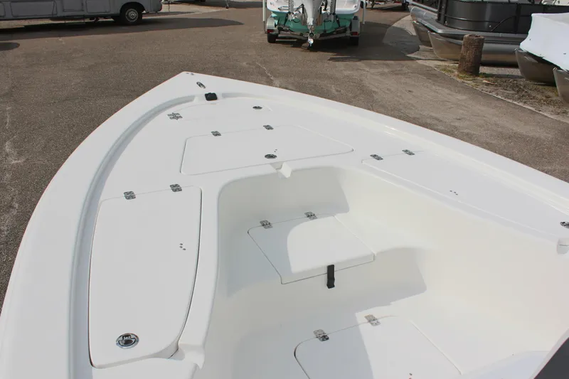 Slide: The Image of 2025 Sea Pro 230 Bay boat deck with storage compartments. - 23