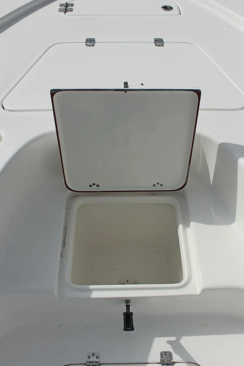 Slide: The Image of 2025 Sea Pro 230 Bay boat storage compartment open on deck. - 26