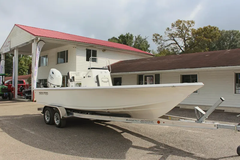 Slide: The Image of 2025 Sea Pro 230 Bay boat on trailer outside dealership. - 3