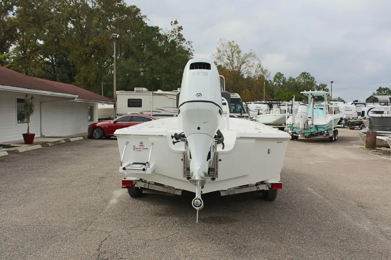 Slide: The Image of 2025 Sea Pro 230 Bay boat on trailer, parked outdoors. - 4