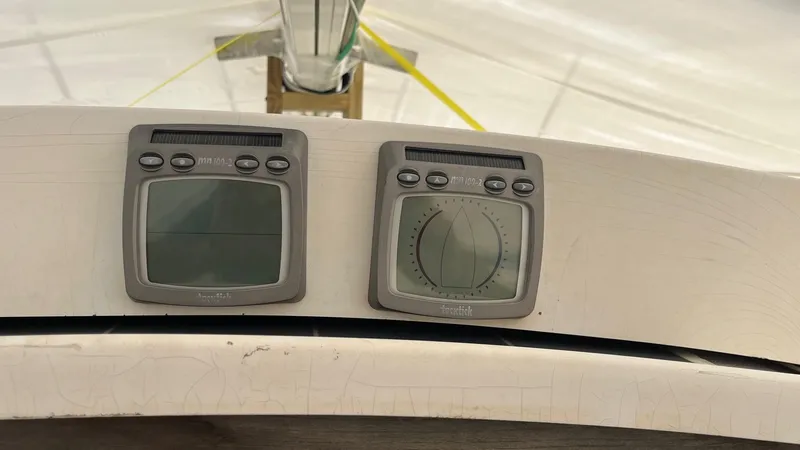 Slide: The Image of 2001 J Boats J/105 sailboat instruments, featuring dual navigation displays. - 11