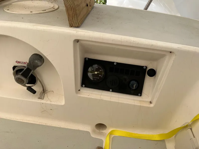 Slide: The Image of Control panel of a 2001 J Boats J/105 sailboat with throttle and gauges. - 12